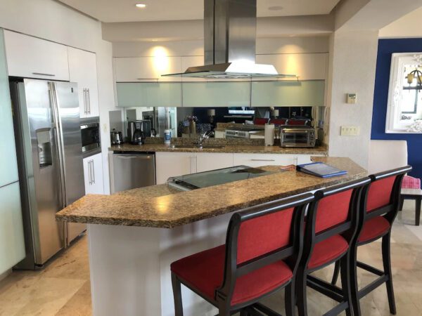 Kitchen with 3 chairs and table